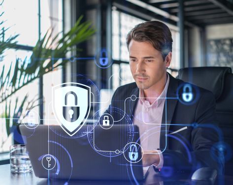 An image of a man working on a computer