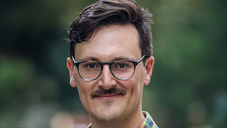 Associate Professor Publishes Book, Advocating for Radical U.S. Public School Financial Reform