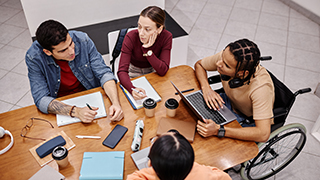 Diverse group of students studying together Diverse group of students studying together