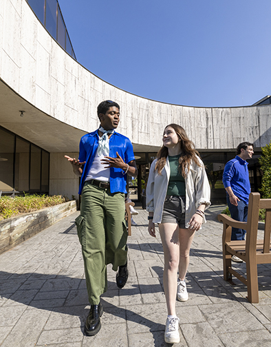 Students walking on campus near Arts and Sciences Hall.